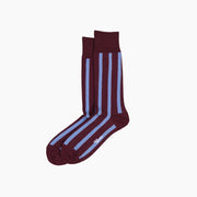 Burgundy and purple vertical stripes socks on grey background.