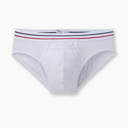 All american white brief with navy and read stripe waist band laid flat on grey background.