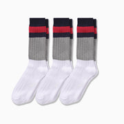 3 pairs of White, grey, blue and red striped chunky knit socks laid flat on light grey background.