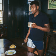 Man wearing regatta slim fit boxers and polo with pancakes at the dinner table.