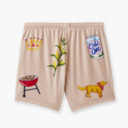 Beige lounge short that says "cash rules everything around me" with various icons like crown, grill, dog, plant and a beer sitting flat on grey background.