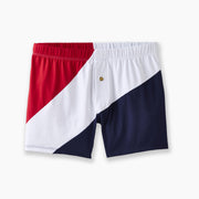 Britannia slim fit boxer featuring large blue, white, and red stripe laid flat on light grey background. 