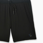 Black pocket lounge short with serpent embroidery on bottom right of leg.