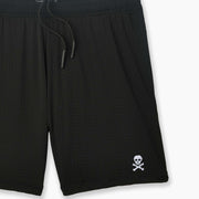 Black pocket lounge short with skull embroidery on bottom right of leg.
