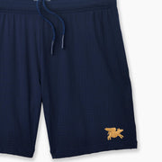 Navy Blue pocket lounge short with gold flying pig embroidery on bottom right of leg.