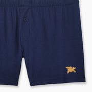 Navy Blue slim fit boxer with golden flying pig embroidery in bottom right corner.