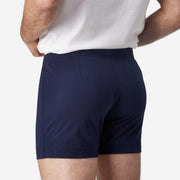 Close up back view of man wearing navy blue slim fit boxer and white t-shirt.