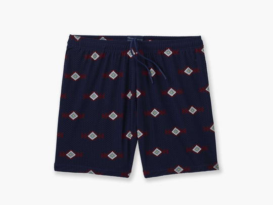 Pair of navy blue Cabin Club lounge shorts against light grey background