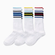 3 pairs of white Amalfi Athletic socks with stripes on the cuff in various colors.
