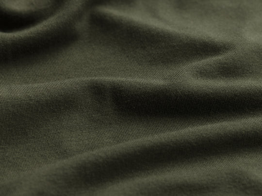 Close up detail shot of inside olive micromodal material