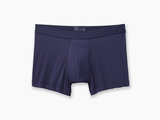 Navy boxer brief layflat on grey background.