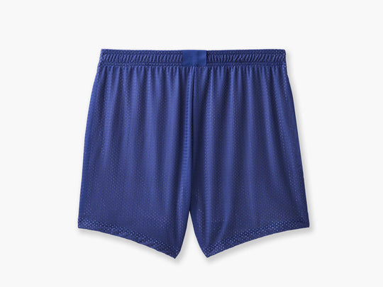Back shot of half checkered half solid blue and white mesh lounge shorts sitting flat on grey background.