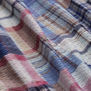 Close up detail shot of plaid pattern found on Blue Madras lounge short. 