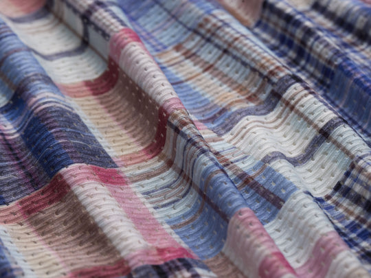 Close up detail shot of plaid pattern found on Blue Madras lounge short. 