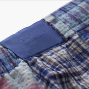 Close up detail shot of the back label found on Blue Madras Pocket Lounge Short. 