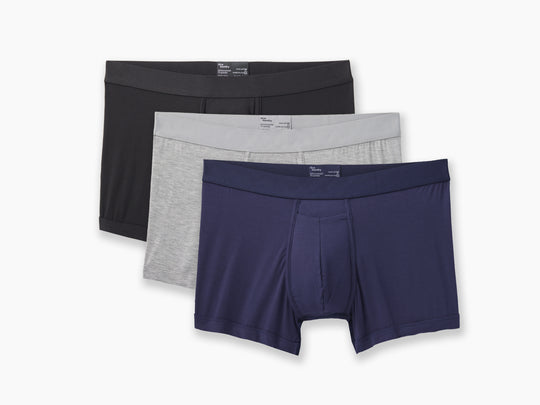 Boxer Brief Variety pack in black, heather grey and navy blue all laid on light grey background..