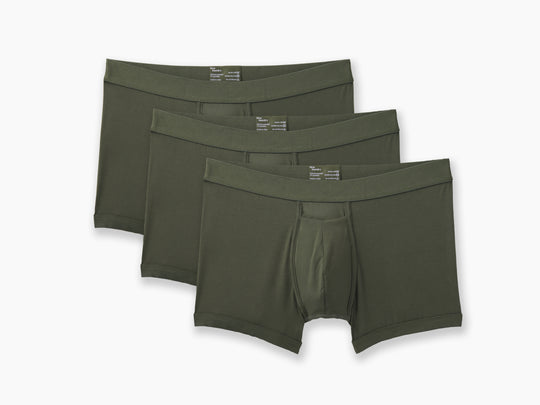3 pairs of Olive boxer briefs on grey background.