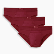 Three pairs of burgundy briefs on a white background