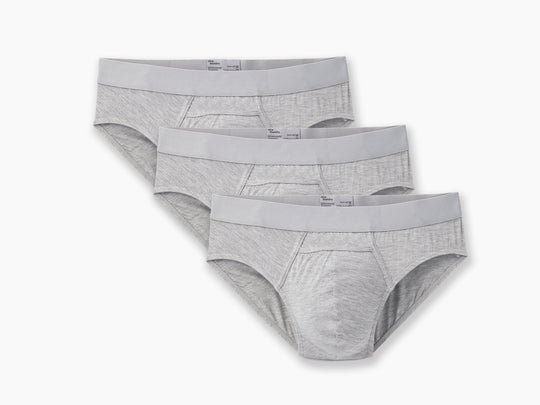 3 pairs of heather grey briefs laid flat on light grey background.