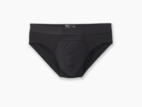 Black brief laid flat on grey background.
