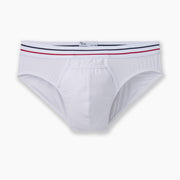 All american white brief with navy and read stripe waist band laid flat on grey background.