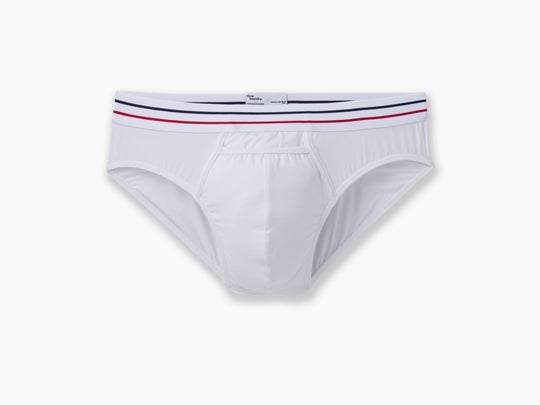 All american white brief with navy and read stripe waist band laid flat on grey background.