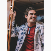 Close up of man on boat wearing burgundy vintage ringer t shirt