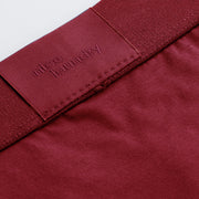 Close up detail shot of back label found on burgundy brief