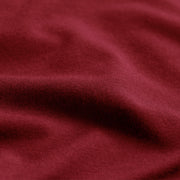 Close up detail shot of burgundy micromodal material