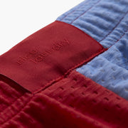 Close up detail shot of back label found on Canoe Stripe lounge short.