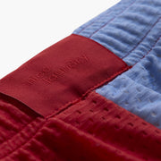 Close up detail shot of back label found on Canoe Stripe lounge short. 