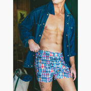 Close up of man wearing denim jacket and classic madras slim fit boxers 