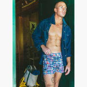 Man wearing denim jacket and classic madras slim fit boxers 