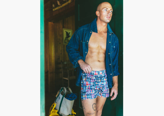 Man wearing denim jacket and classic madras slim fit boxers 
