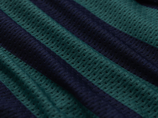 Close up detail shot of green/navy stripe lounge shorts