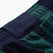 Close up of back label found on green/navy stripe lounge shorts