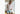Man standing inside wearing white dress shirt and Light Blue Doghouse slim fit boxer (orange with small icons like dog house, golf clubs, card etc)