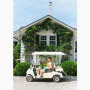 Shirtless man riding a golf cart wearing a green Doghouse slim fit boxer (green  with small icons like dog house, golf clubs, card etc)