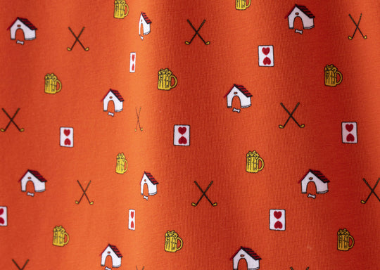 Close up detail shot of Orange Doghouse slim fit boxer (orange with small icons like dog house, golf clubs, card etc)
