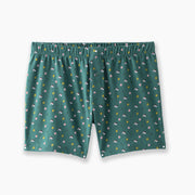 A pair of hunter Doghouse slim fit boxers sitting flat on light grey background. Boxers have doghouse, golf clubs, and cards printed in small repeating pattern.