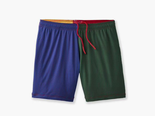 Front shot of multi colored (blue, green, yellow and red) mesh lounge shorts with red drawstrings laid flat on light grey background.