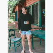 Man standing wearing black hoodie and green madras slim fit boxer