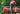 Back shot of man in forest climbing on canoe wearing red shirt and grey lounge short.