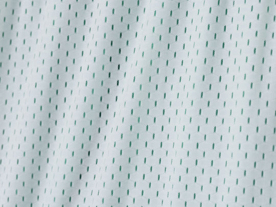 Close up detail shot of white mesh material.