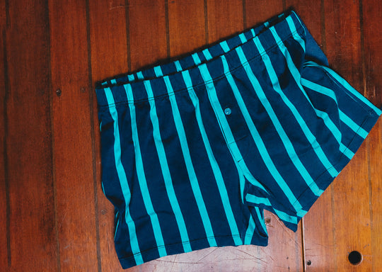 Ivy Stripe slim fit boxer on wood background.