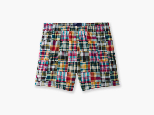 Pair of Madras printed lounge shorts laid flat on light grey background.