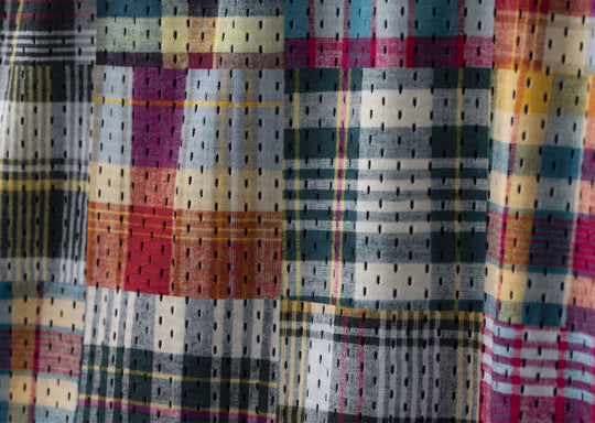 close up detail shot of Madras print lounge shorts.
