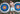 Shirtless man standing in front of 2 large archery targets holding a bow and wearing white mesh shorts.