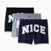 Three pairs of slim fit boxers with the word "NICE" on front in big white bold front. There are navy blue, heather grey, and black pairs laid flat on light grey backround.
