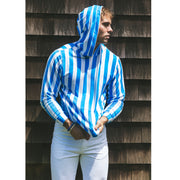  Man standing by roof wearing blue and white stripped hoodie.